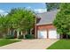 Brick home exterior with an attached two car garage and well-maintained lawn at 5013 Kendall Nw Sta, Acworth, GA 30102