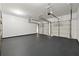 Spacious three car garage with painted walls and floors and three overhead automatic doors at 5013 Kendall Nw Sta, Acworth, GA 30102