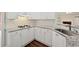 Kitchen with granite countertops, stainless steel sink and white cabinetry at 5013 Kendall Nw Sta, Acworth, GA 30102