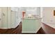Open kitchen featuring white cabinets, granite countertops, and hardwood floors at 5013 Kendall Nw Sta, Acworth, GA 30102