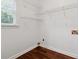 Bright laundry room featuring hardwood floors, built in shelving, and a window for natural light at 5013 Kendall Nw Sta, Acworth, GA 30102