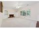 Living room with built in shelves, fireplace, ceiling fan and a large window at 5013 Kendall Nw Sta, Acworth, GA 30102
