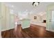 View of the open kitchen and living space, with wood flooring and fireplace at 5013 Kendall Nw Sta, Acworth, GA 30102