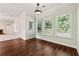 Sunroom with three windows overlooking the yard and wood floors at 5013 Kendall Nw Sta, Acworth, GA 30102