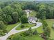 Expansive property featuring a well-maintained home, lush landscaping, and serene wooded surroundings at 590 Arthur Rd, Canton, GA 30115