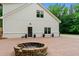 Brick patio featuring a stone fire pit with plenty of space for outdoor enjoyment at 590 Arthur Rd, Canton, GA 30115