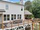 Spacious backyard deck with dining and lounge areas, perfect for outdoor entertainment and relaxing at 590 Arthur Rd, Canton, GA 30115