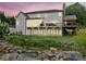 Expansive backyard featuring a beautifully landscaped pond and a spacious deck ideal for entertaining at 590 Arthur Rd, Canton, GA 30115