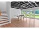 Finished basement with wood-look floors, painted ceiling, and large windows, great for recreation at 590 Arthur Rd, Canton, GA 30115