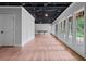 Finished basement featuring wood flooring and a wall of windows providing ample natural light at 590 Arthur Rd, Canton, GA 30115