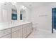 Stylish bathroom with double vanity, blue accent tile and modern lighting at 590 Arthur Rd, Canton, GA 30115