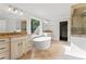 Luxurious bathroom with dual vanities, soaking tub, and a glass shower at 590 Arthur Rd, Canton, GA 30115