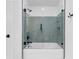 Modern bathroom features a glass-enclosed shower and neutral tile at 590 Arthur Rd, Canton, GA 30115
