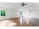 Spacious bedroom with tray ceilings, hardwood floors, and natural light at 590 Arthur Rd, Canton, GA 30115