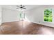 Spacious bedroom with hardwood floors, recessed lighting, and bright windows at 590 Arthur Rd, Canton, GA 30115