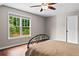 Comfortable bedroom with hardwood floors, natural light and neutral color palette at 590 Arthur Rd, Canton, GA 30115
