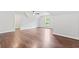 Open bedroom with dark hardwood floors, ceiling fan, neutral walls and bright natural light at 590 Arthur Rd, Canton, GA 30115