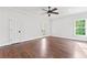 Bedroom featuring hardwood floors, natural light, and two doors at 590 Arthur Rd, Canton, GA 30115