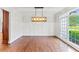 Dining room with hardwood flooring, wainscotting and an ornate chandelier at 590 Arthur Rd, Canton, GA 30115