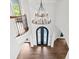 Aerial view of foyer with iron door and chandelier with high ceilings and arched doorways at 590 Arthur Rd, Canton, GA 30115