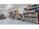 Cluttered garage featuring storage shelving and various household items at 590 Arthur Rd, Canton, GA 30115