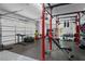 Spacious home gym with a variety of workout equipment and an open layout at 590 Arthur Rd, Canton, GA 30115