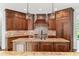 Spacious kitchen featuring granite countertops, a large island, and custom cabinets at 590 Arthur Rd, Canton, GA 30115