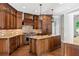 Custom kitchen with granite countertops, island, and brick backsplash at 590 Arthur Rd, Canton, GA 30115