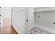 Well-equipped laundry room with washer/dryer hookups and ample shelving at 590 Arthur Rd, Canton, GA 30115