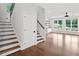 Spacious living room with hardwood floors and a staircase, with white trim and baseboards at 590 Arthur Rd, Canton, GA 30115
