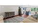 Inviting living area showcasing hardwood floors, stylish furniture, and an adjacent modern kitchen at 590 Arthur Rd, Canton, GA 30115