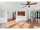 Open floor plan with hardwood floors and a glimpse of the kitchen area at 590 Arthur Rd, Canton, GA 30115