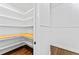 Spacious pantry featuring hardwood floors and ample shelving for storage at 590 Arthur Rd, Canton, GA 30115
