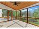 Relaxing screened-in porch with wood ceiling, seating area, and backyard view at 590 Arthur Rd, Canton, GA 30115