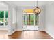 Sunroom with screened porch access and wooden flooring at 590 Arthur Rd, Canton, GA 30115