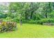 Large backyard featuring mature trees and lush lawn at 933 Capitol View Nw Ave, Atlanta, GA 30318