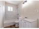 This well-lit bathroom features a tub-shower combo, white vanity, and modern fixtures creating a clean and functional space at 933 Capitol View Nw Ave, Atlanta, GA 30318