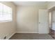 The bright bedroom features neutral walls, plush carpet, and a doorway that transitions into wood flooring at 933 Capitol View Nw Ave, Atlanta, GA 30318