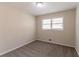 This cozy bedroom features neutral walls, plush carpet, and a window that brings in plenty of natural light at 933 Capitol View Nw Ave, Atlanta, GA 30318