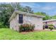 Charming single-story home featuring a well-kept lawn, dark door and lush landscaping at 933 Capitol View Nw Ave, Atlanta, GA 30318