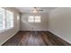 Bright living room featuring wood floors, neutral walls, and natural light from large windows at 933 Capitol View Nw Ave, Atlanta, GA 30318