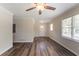 Bright living room featuring wood floors, neutral walls, and natural light from large windows at 933 Capitol View Nw Ave, Atlanta, GA 30318