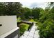 An aerial view showcases the home's manicured yard, driveway, and surrounding neighborhood at 1099 Vista Ne Trl, Atlanta, GA 30324