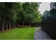 A lush, green backyard with a charming wooden structure, perfect for outdoor enjoyment and relaxation at 1099 Vista Ne Trl, Atlanta, GA 30324