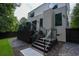 The backyard has a two-story home with a modern exterior and a deck with glass railings at 1099 Vista Ne Trl, Atlanta, GA 30324