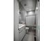 Neutral bathroom featuring a modern vanity, sleek fixtures, and a shower with a curtain at 1099 Vista Ne Trl, Atlanta, GA 30324