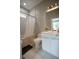 This bathroom features a white vanity, a large mirror, and a bathtub with shower at 1099 Vista Ne Trl, Atlanta, GA 30324