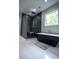 Modern bathroom featuring a standalone tub, glass shower, and bright window with natural light at 1099 Vista Ne Trl, Atlanta, GA 30324