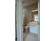 Clean, modern bathroom with a white vanity and tiled floors at 1099 Vista Ne Trl, Atlanta, GA 30324