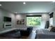 Modern bedroom with a large window offering scenic views of surrounding greenery at 1099 Vista Ne Trl, Atlanta, GA 30324